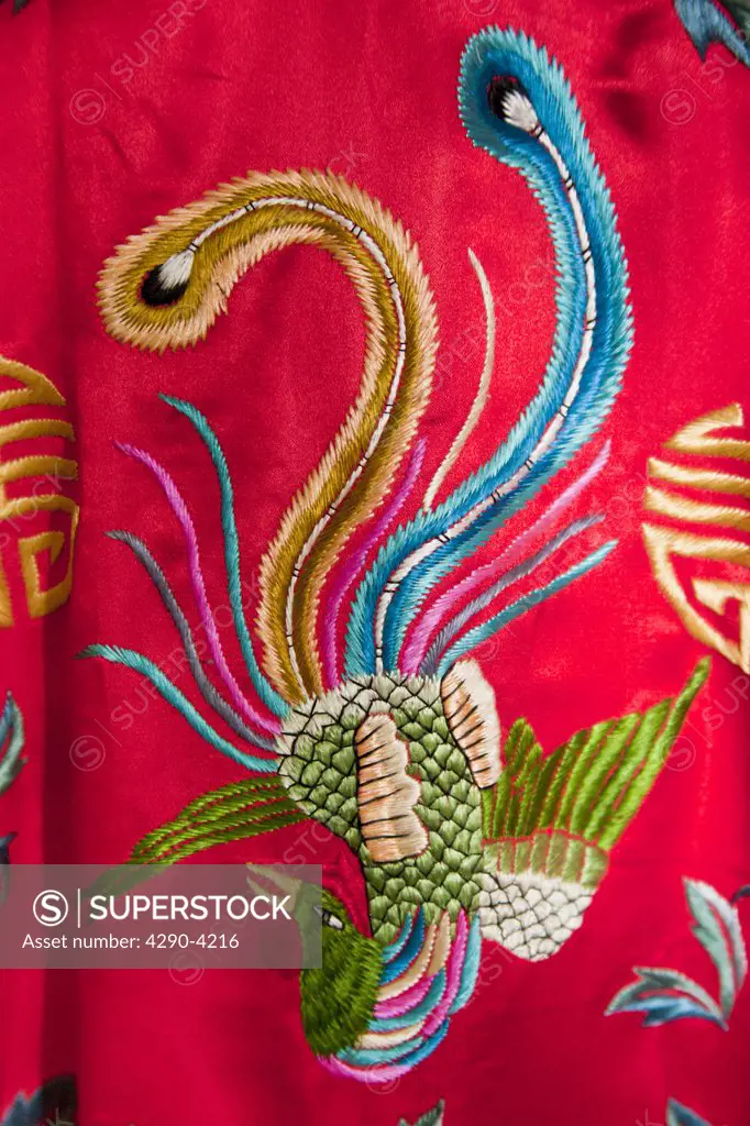 Colourful red Chinese embroidered silk garment depicting a phoenix bird, for sale, China