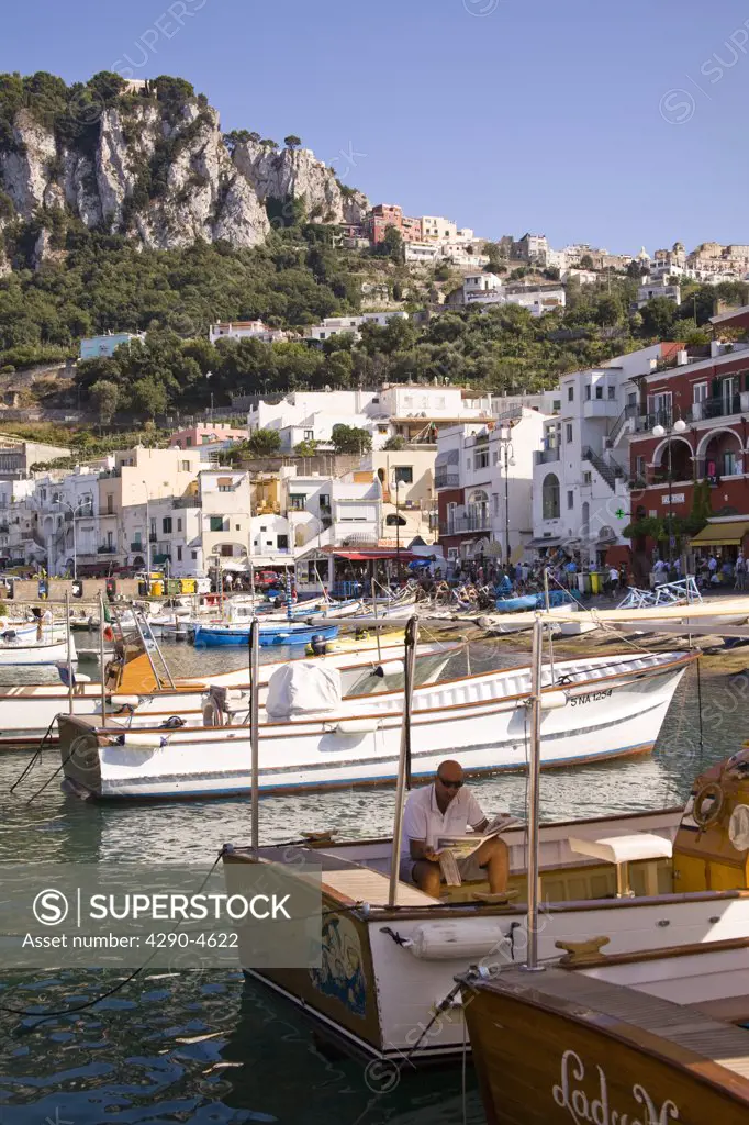 View of harbour, boats, buildings and mountains, Marina Grande, Capri, Italy