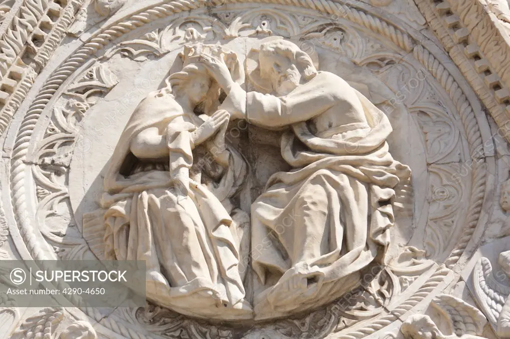 Religious stone carving on outside wall of Messina Cathedral, Piazza Del Duomo, Messina, Sicily, Italy