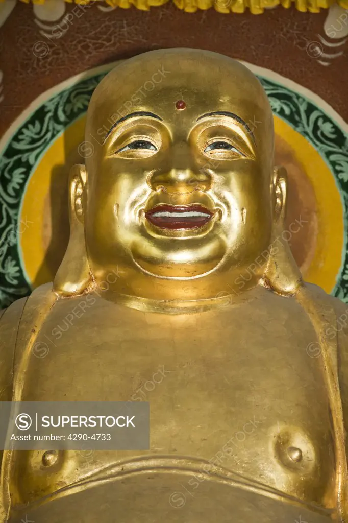 Smiling golden Buddha, Wenshu Temple, Chengdu, Sichuan Province, China