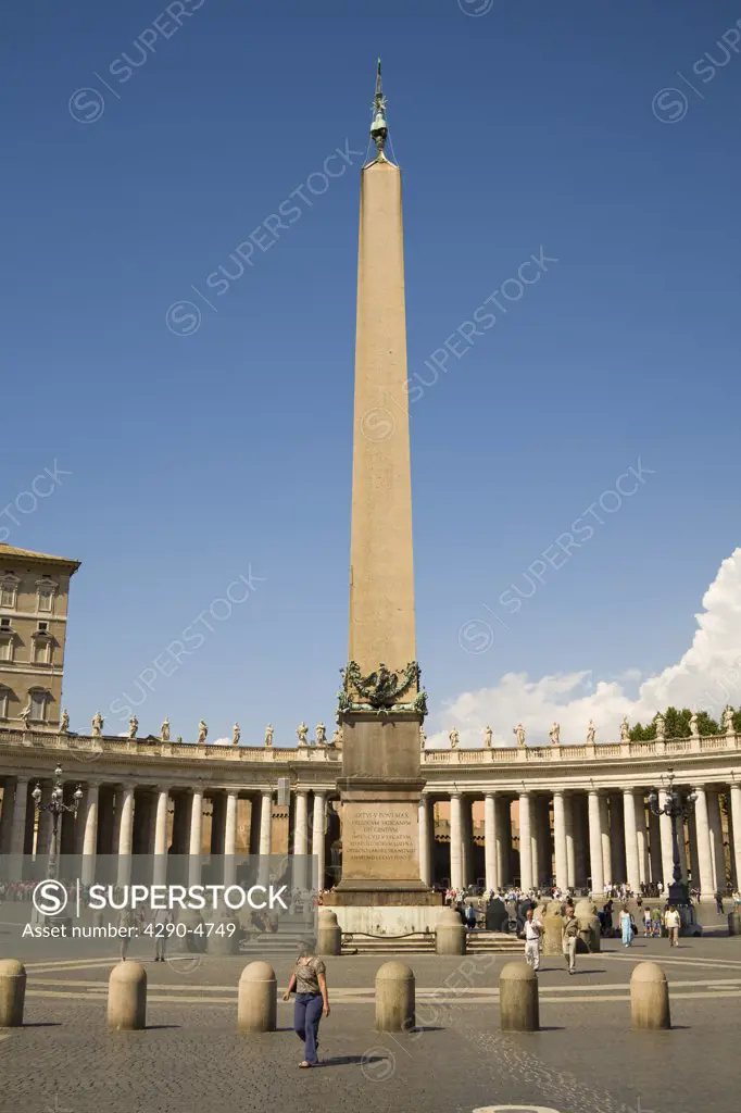 Obelisk and tourists in Saint Peters Square, Piazza San Pietro, Vatican City, Rome, Italy