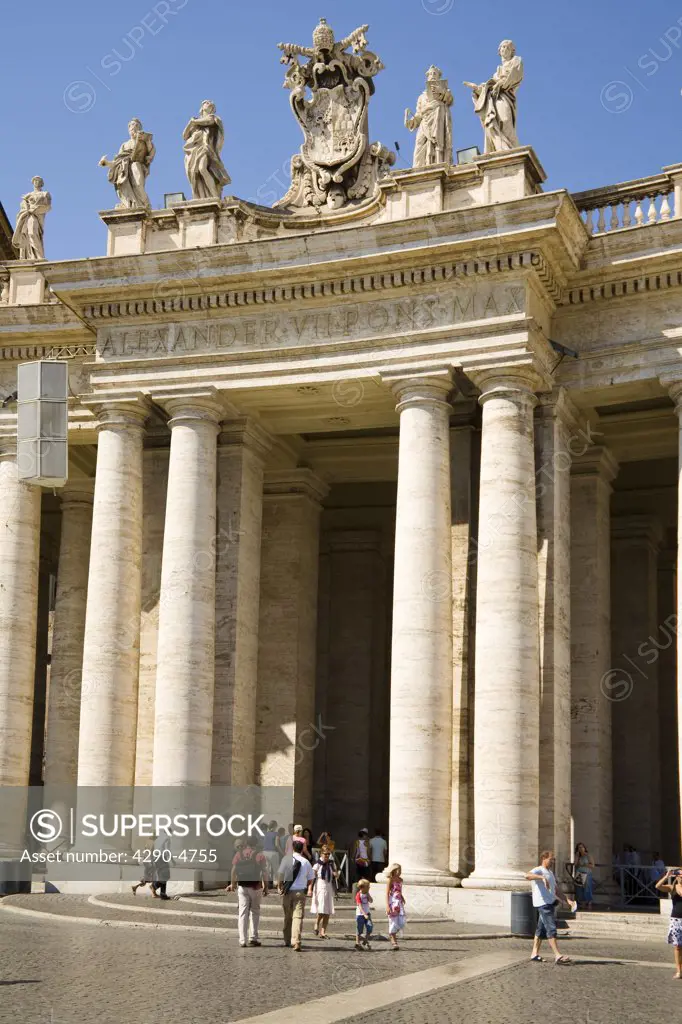 Archway and tourists in Saint Peters Square, Piazza San Pietro, Vatican City, Rome, Italy