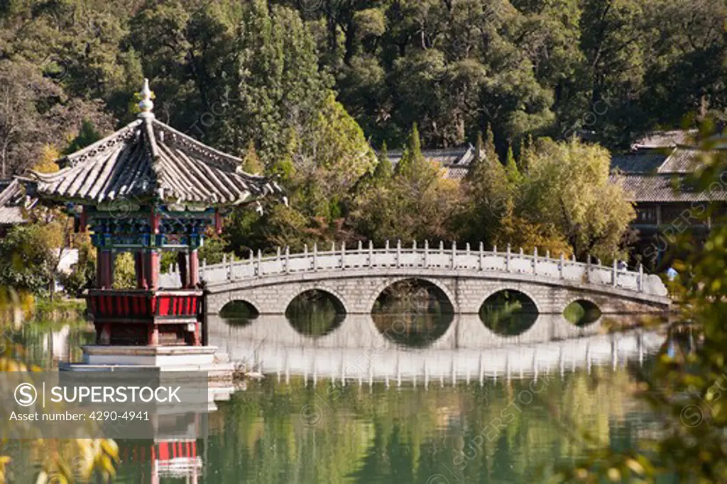 Pagoda and Suocui bridge reflecting in the Black Dragon Pool, Lijiang, Yunnan Province, China