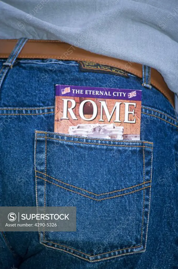 The Eternal City of Rome guide book in tourists pocket, Rome, Italy