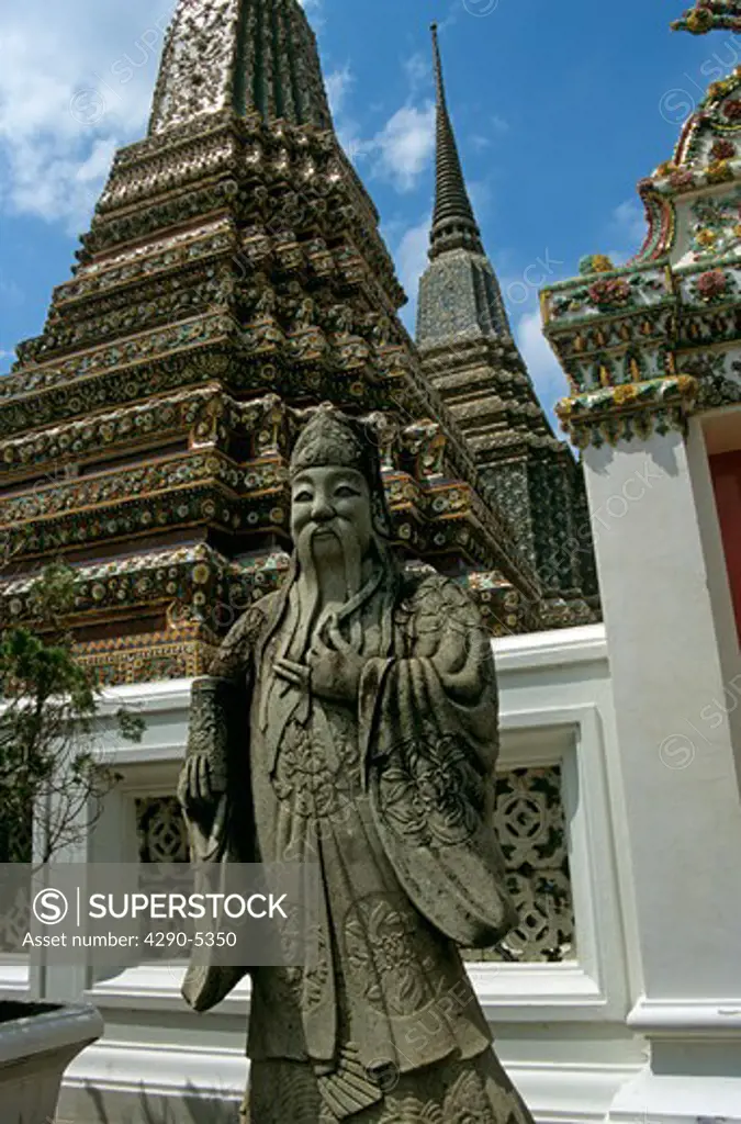Statue and chedis, Temple of the Reclining Buddha, Wat Po (also known as Wat Potaram and Wat Phra Chetuphon), Bangkok, Thailand