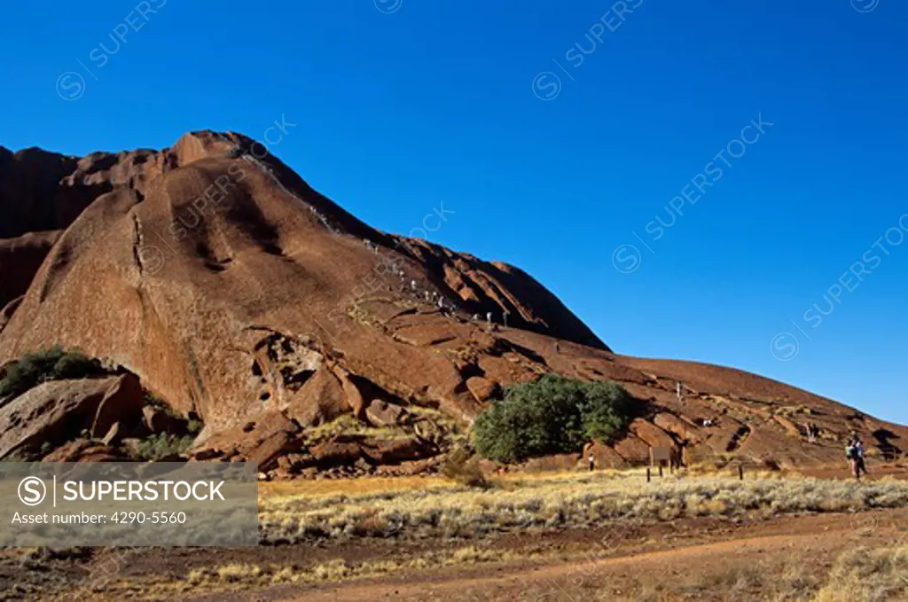 Mount Uluru, Ayers Rock, Kata Tjuta National Park, Northern Territory, Australia. People climbing.