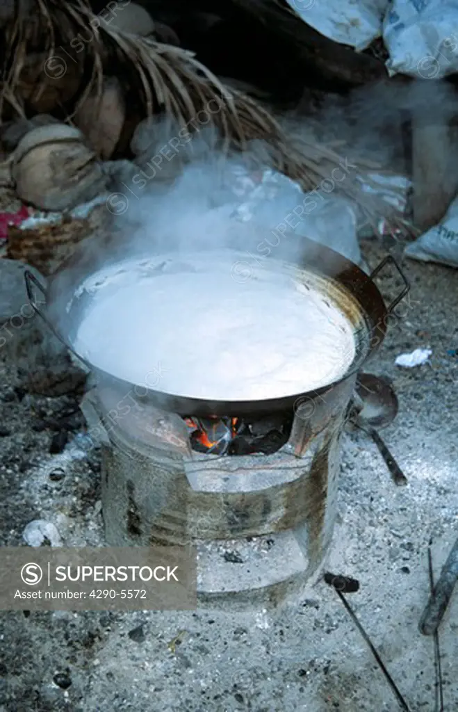Boiling pan of white coconut sugar at coconut plantation, Thailand