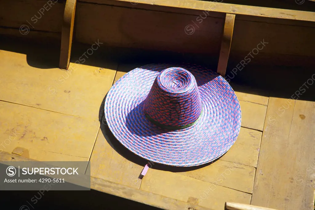 Hat lying in bottom of boat, Damnoen Saduak floating market, Ratchaburi Province, near Bangkok, Thailand