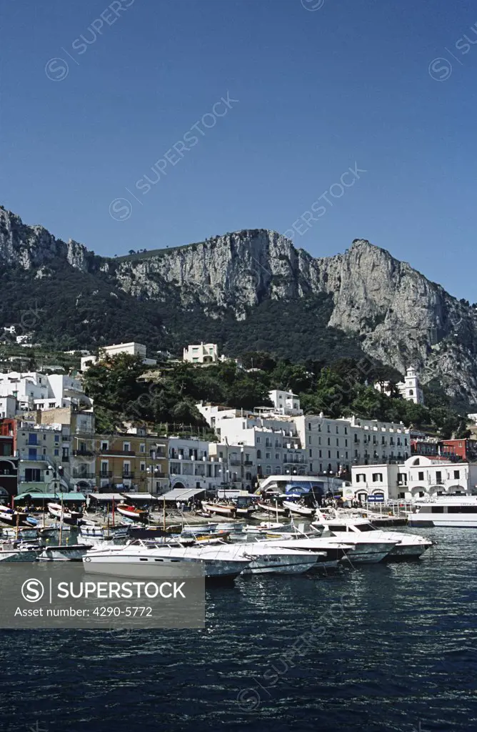 View of harbour, buildings and mountains from the sea, Marina Grande, Capri, Italy
