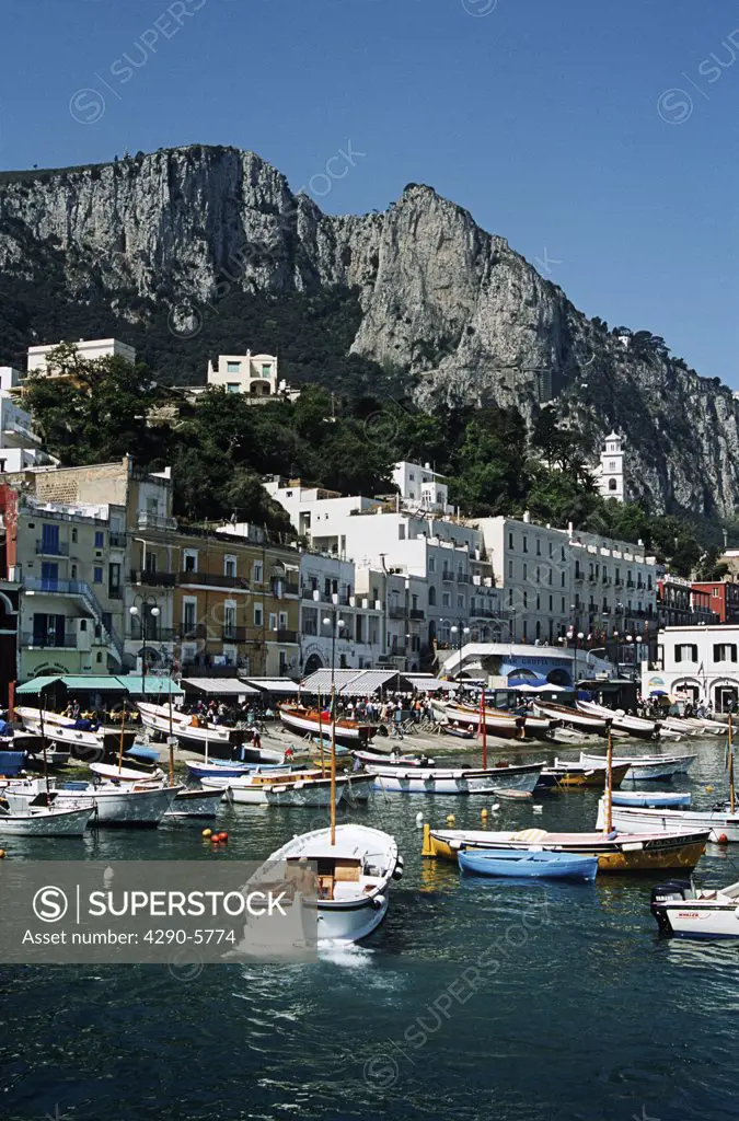 View of harbour, buildings and mountains from the sea, Marina Grande, Capri, Italy
