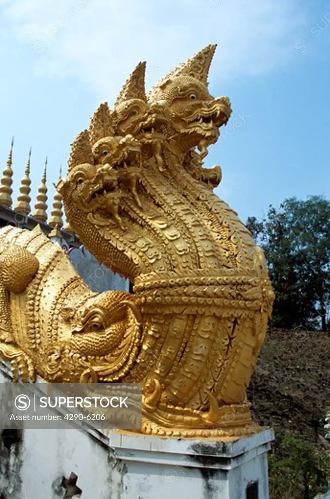 Ornate golden snake statue, Wat Phra That Suton Mong Konkiree Temple, Denchai District, Phrae Province, Thailand