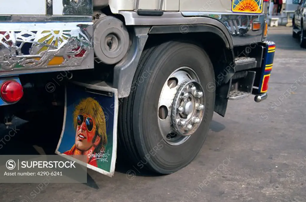Colourful portrait on a mud flap on a lorry, Thailand