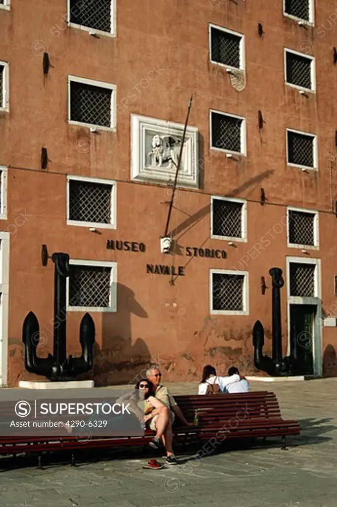 Tourists sitting and relaxing outside Museo Storico Navale, Naval Maritime Museum, Venice, Italy