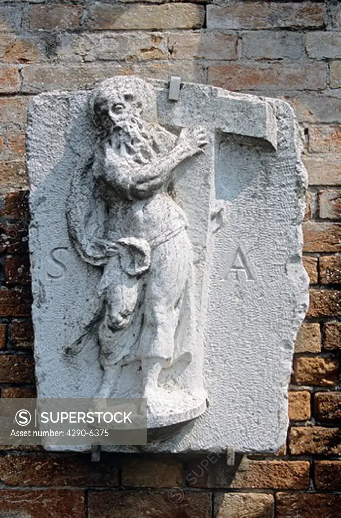 Religious statue on wall, Torcello Museum, Museo Di Torcello, on the island of Torcello, Venice, Italy