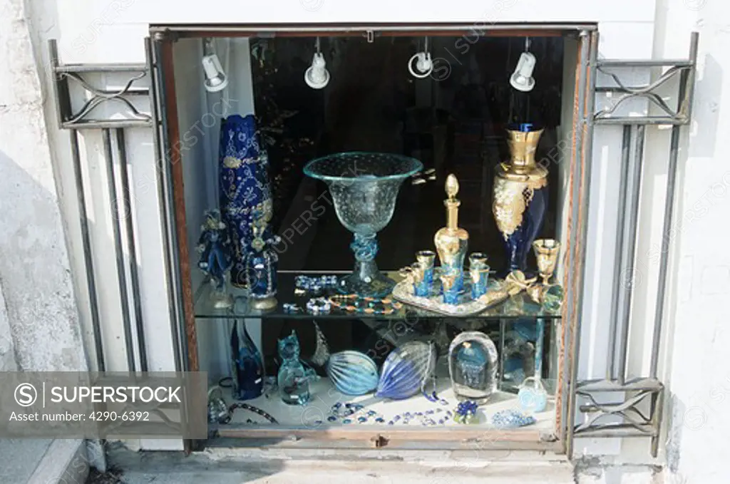 Glass gifts for sale as seen through gift shop window, Venice, Italy
