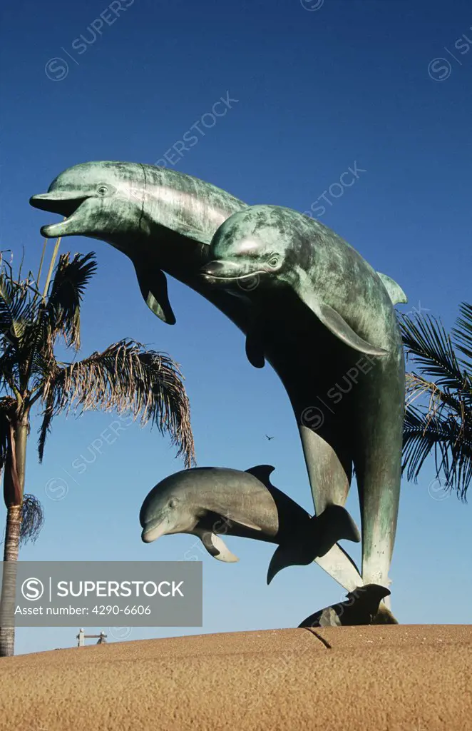 Sculpture of dolphins jumping out of the sea, California, USA