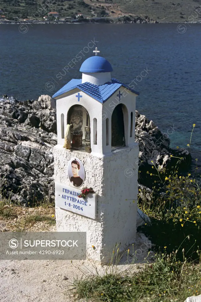 Shrine in memory of young man at roadside, Agia Efimia, Kefalonia, Greece