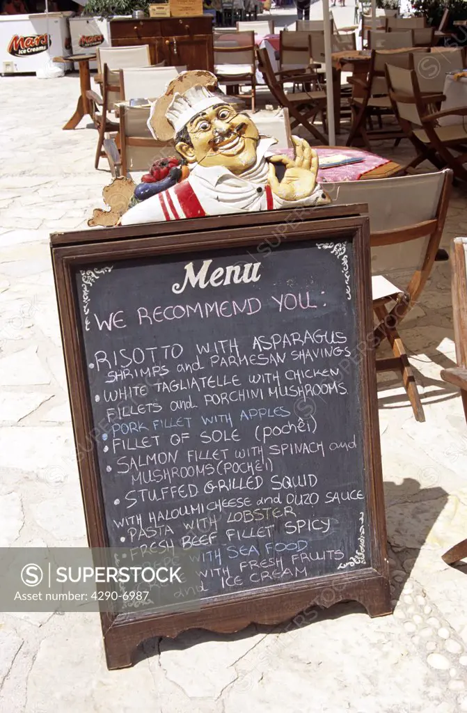 Restaurant menu on pavement, Fiskardo, Kefalonia, Greece