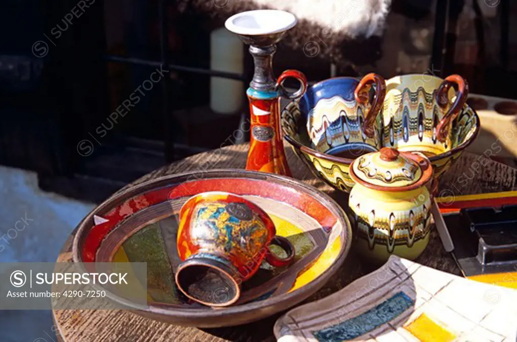 Traditional Bulgarian pottery on display outside gift and craft shop, Bansko, Bulgaria