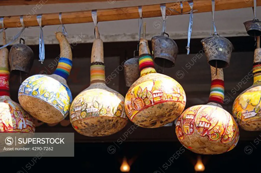 Colourful gourds and cattle bells hanging outside shop, Melnik, Bulgaria