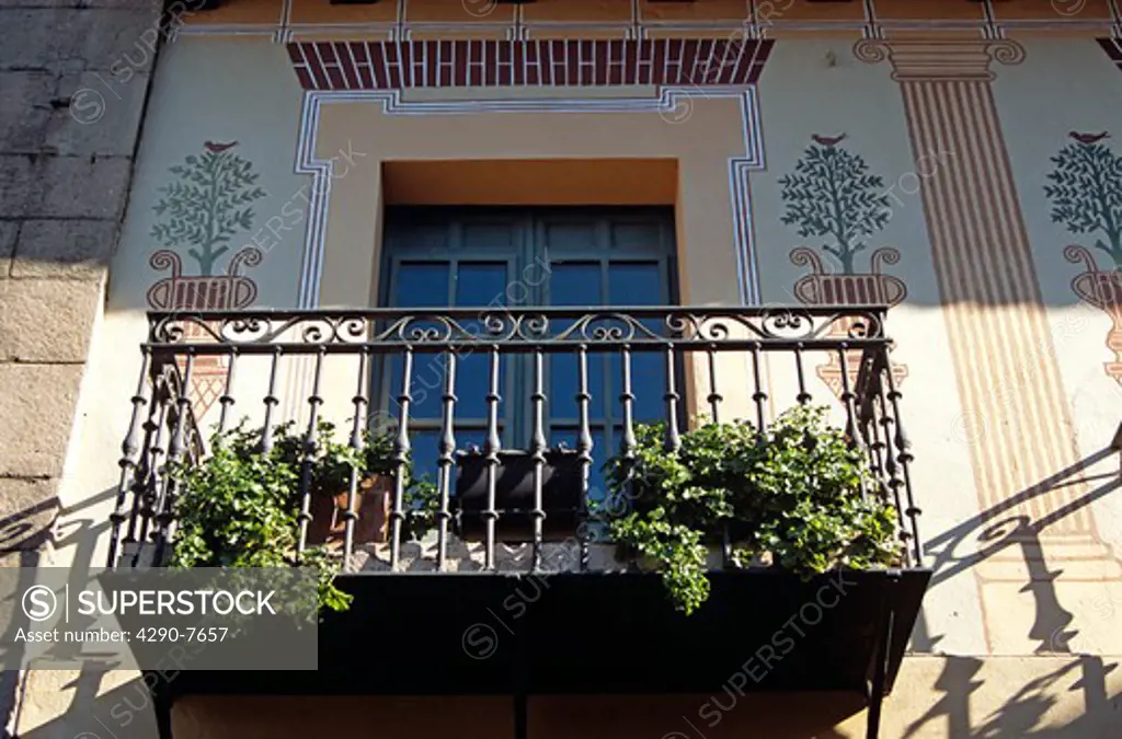 Poble Espanyol (Spanish Village) de Montjuic, Barcelona, Spain. Ornate balcony and paintings on wall.