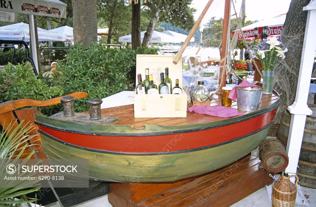 Still life model of yacht, wine bottles, flowers, Cavtat, near Dubrovnik, Dalmatian Coast, Croatia, Former Yugoslavia