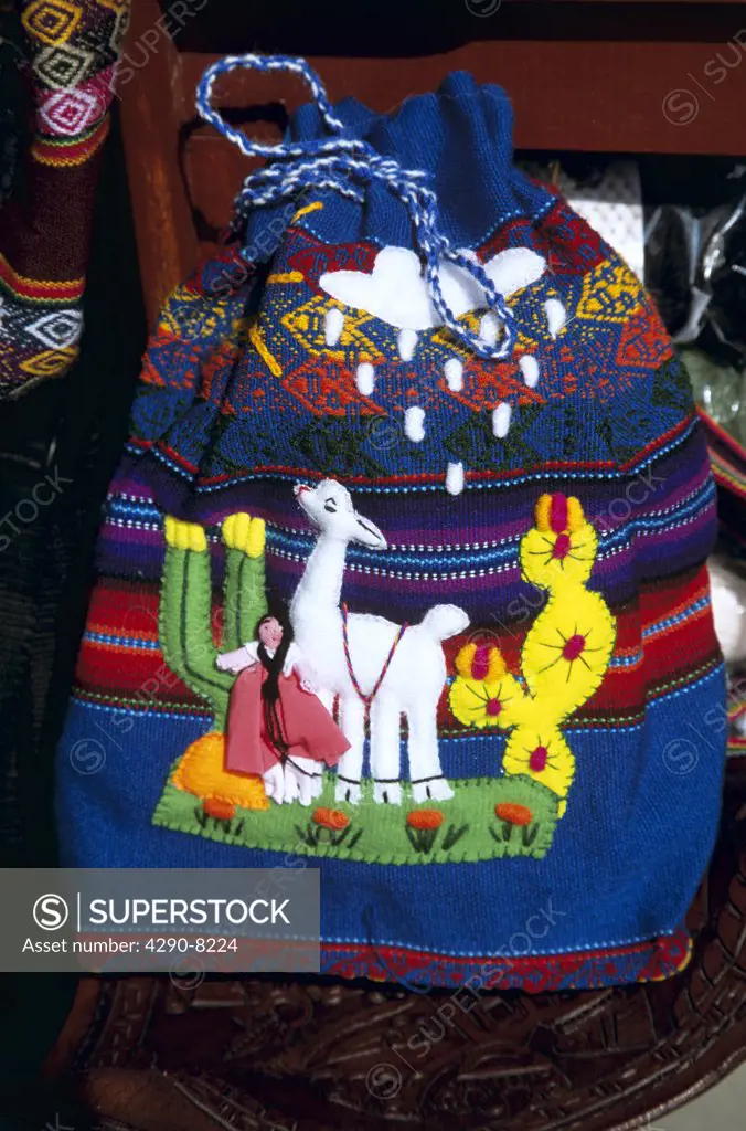 Colourful bag depicting alpaca or llama, outside shop, Indian Market, Lima, Peru
