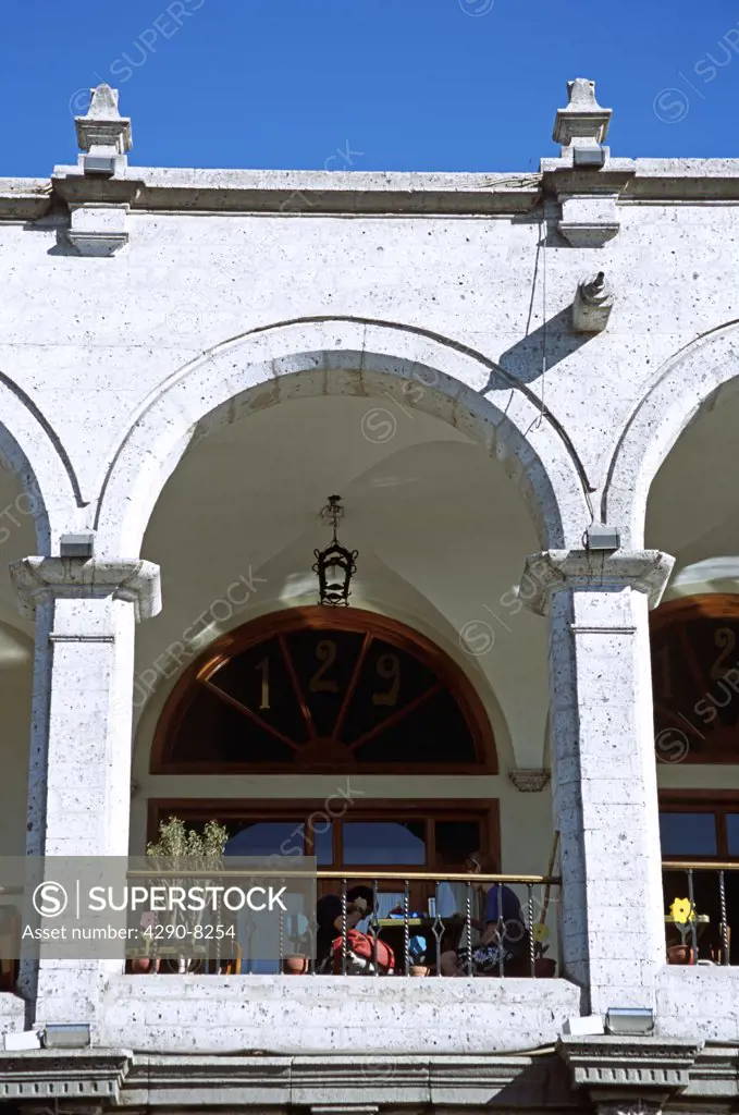 People dining on an arched balcony outside a restaurant, Plaza de Armas, Arequipa, Peru