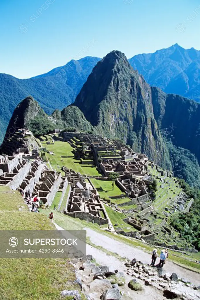 Machu Picchu Inca ruins, terraces, visitors and Huayna Picchu, Peru