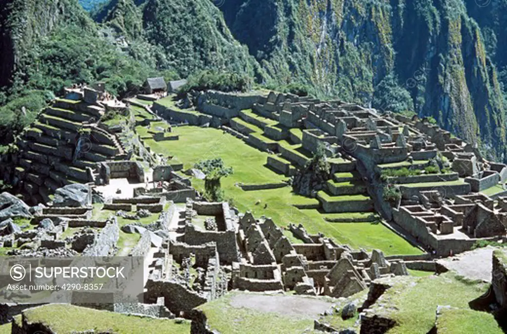 Machu Picchu Inca ruins and terraces at base of Huayna Picchu, Machu Picchu, Peru