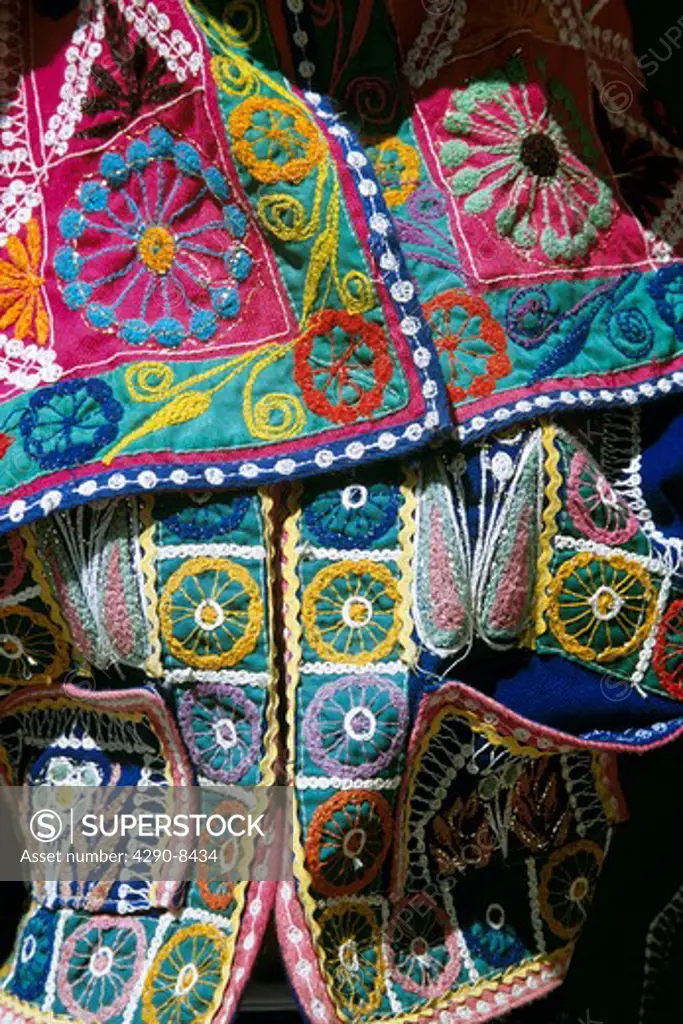 Colourful patterned jacket for sale outside clothing shop, Cusco, Peru