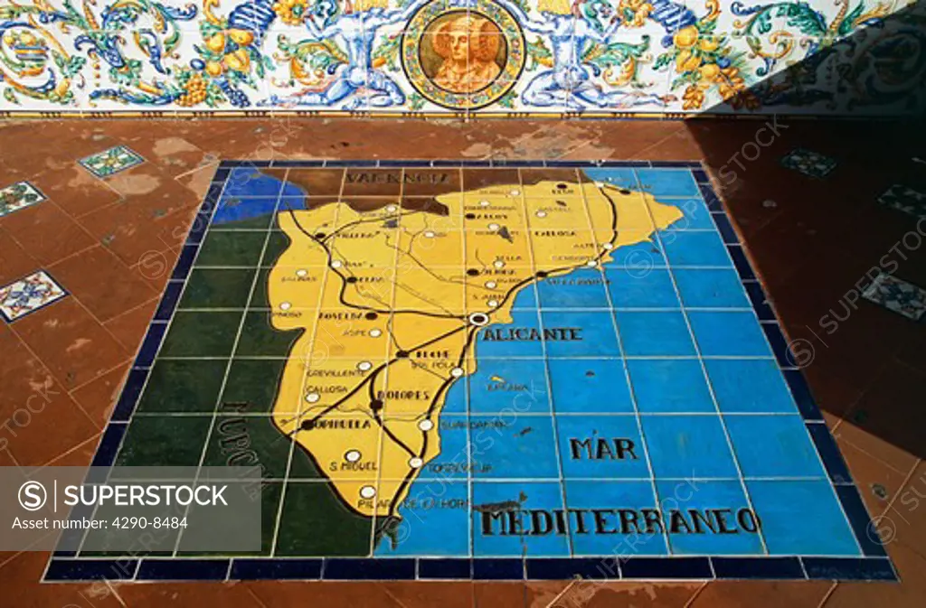 Tiled panel on the ground, depicting map of Alicante region of Spain, in Plaza de Espana, Seville, Spain