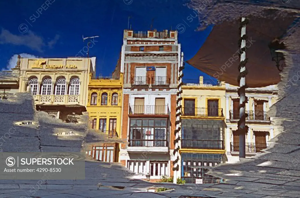 Reflection of buildings in Plaza de San Francisco, Seville, Spain