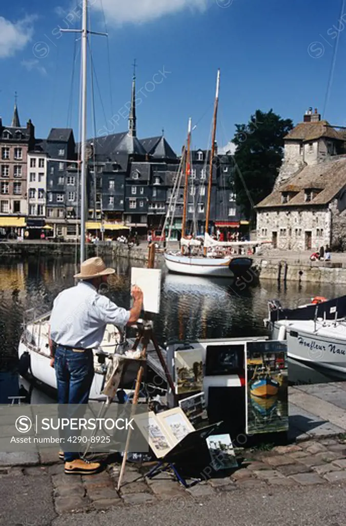 Artist painting, yacht moored, Honfleur Harbour, Honfleur, Normandy, France