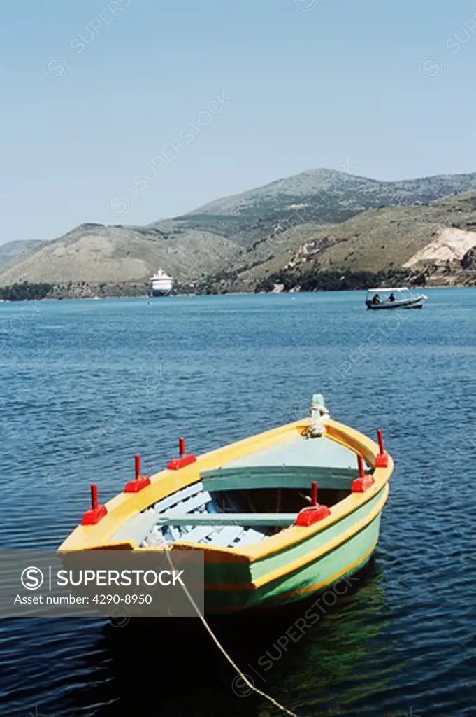 Yellow, red and green rowing boat moored in harbour, Argostoli, Kefalonia, Greece