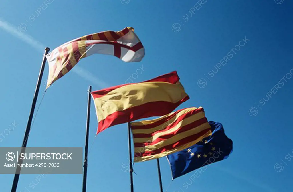 Flags fluttering outside the Royal Palace of Pedralbes, Palau Reial de Pedralbes, Barcelona, Spain