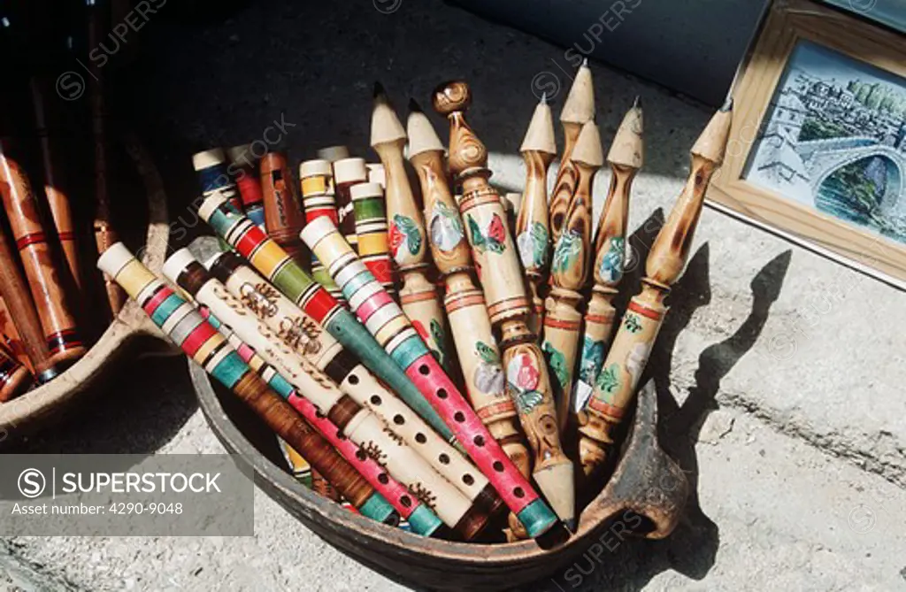 Tray of large painted pencils and flutes outside gift shop, Mostar, Bosnia Herzegovina, Former Yugoslavia