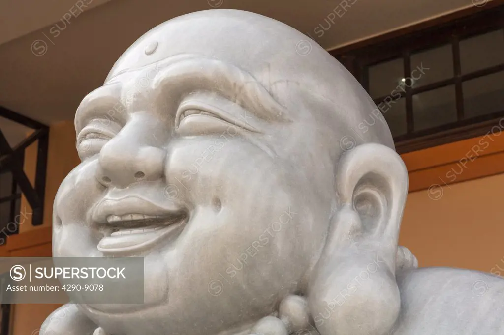 Vietnam, Danang, Stone carving of happy smiling Buddha