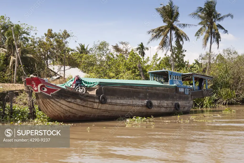 Vietnam, Mekong River Delta, Cai Be, typical boat at riverside mooring
