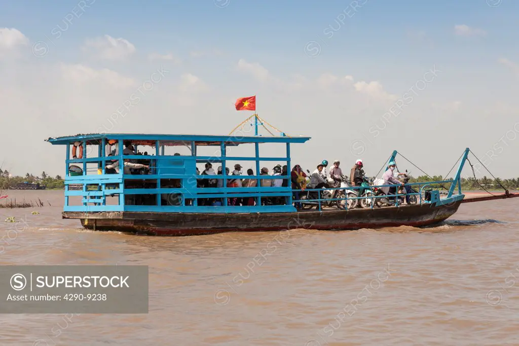 Vietnam, Mekong River Delta, Cai Be, passengers commuting on small ferry boat