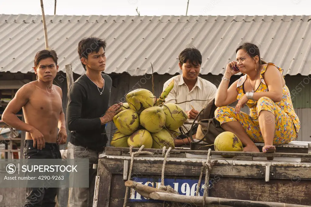 Vietnam, Mekong River Delta, Cai Rang, near Can Tho, people selling coconuts in floating market