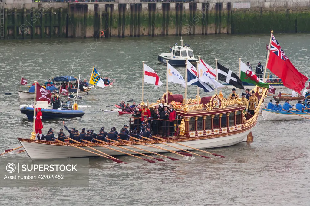 UK, England, London, Rowers aboard Gloriana proceed along River Thames as part of Queen's Thames Diamond Jubilee Pageant