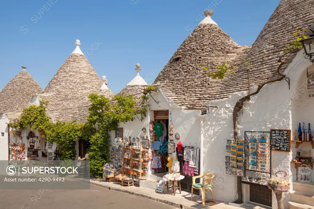 Trulli buildings and shops, Via Monte San Michele, Rione Monti, Alberobello, Bari province, Puglia region, Italy