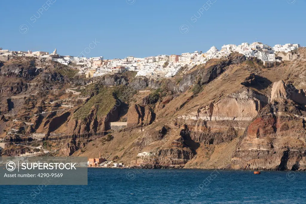 The clifftop town of Fira, the capital town of the Greek island of Santorini, and Skala port below, Greece