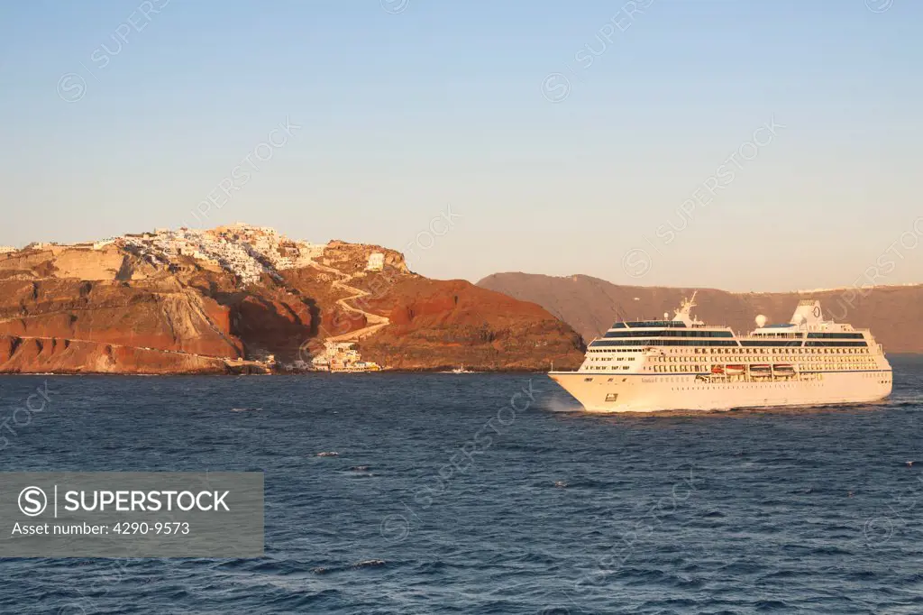 Clifftop village of Oia, and Nautica cruise ship, Santorini, Greece
