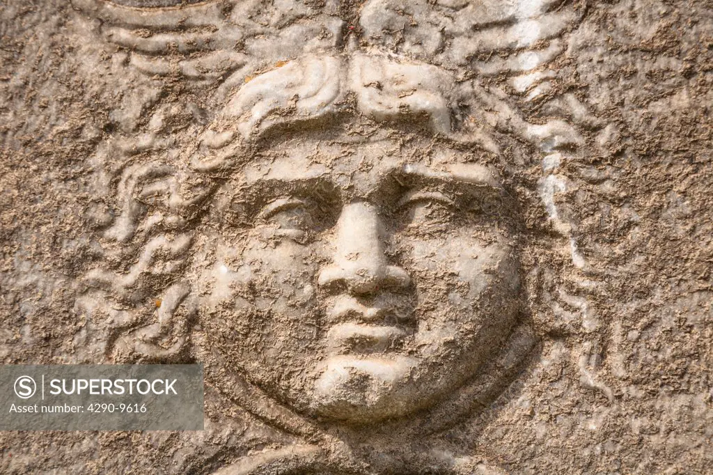 Carved stone face detail on a sarcophagus exhibit, Ephesus, Turkey