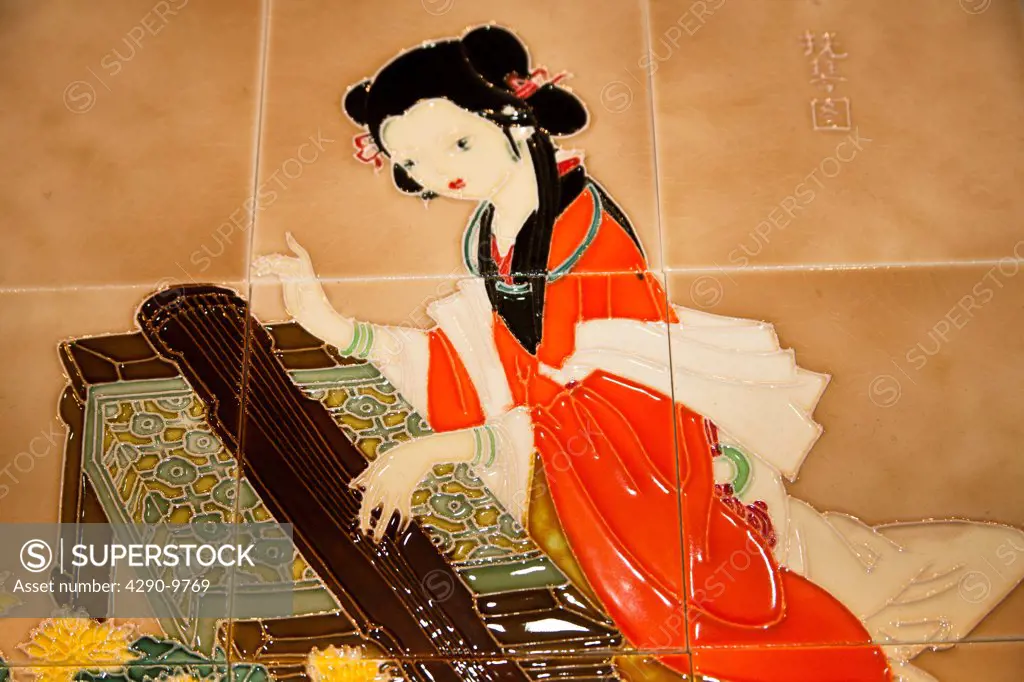 Chinese woman playing a stringed musical instrument depicted on ceramic tiles, China