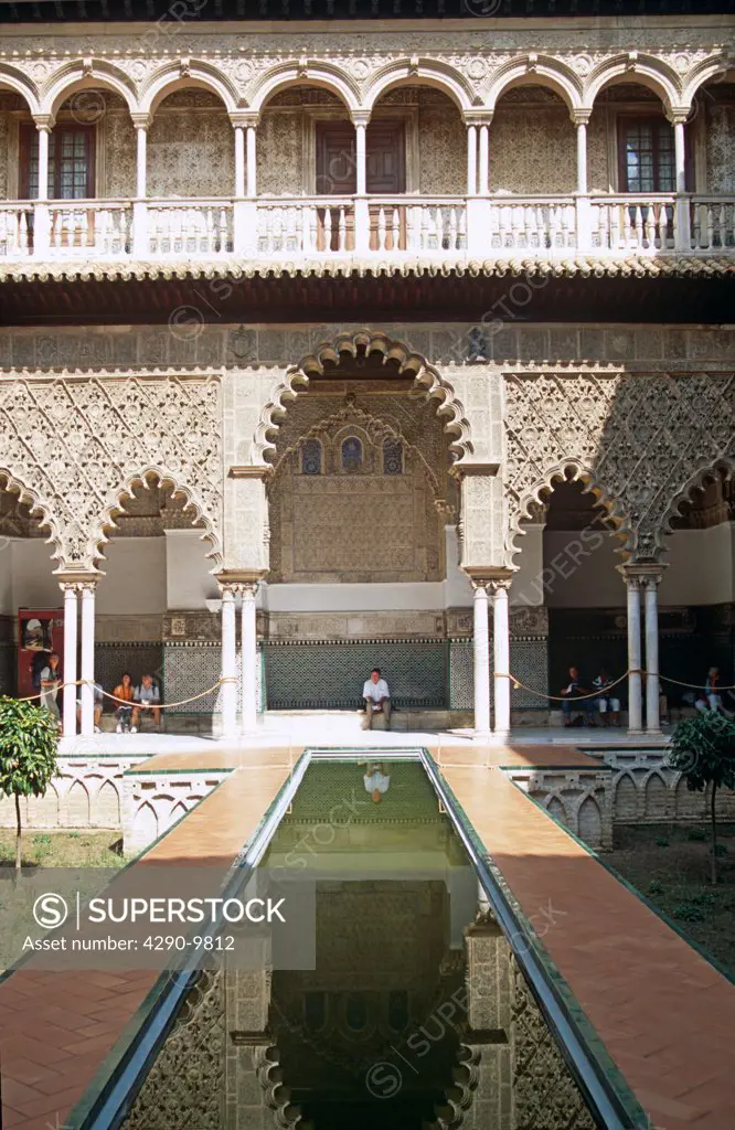 Building and reflection in Courtyard of the Maidens, Palacio Mudejar, Reales Alcazares, Seville, Spain