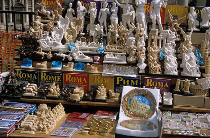 Rome guide books and souvenirs on display on a stall, Rome, Italy