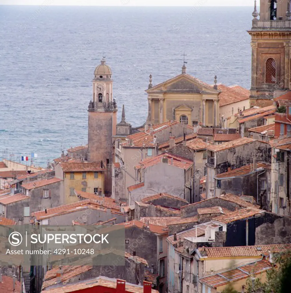 Churches and terracotta tiled roofs in the coastal town of Menton in the South of France